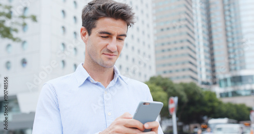 Photography Caucasian man look at mobile phone