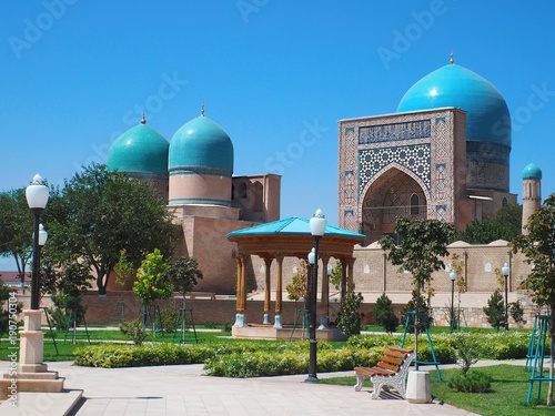 Uzbek gardens in front of Kok Gumbaz Mosque, Shahrisabz, Uzbekistan photo