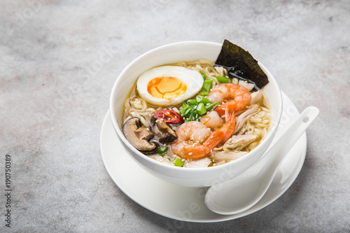 ramen noodle soup with prawn, shiitake mushroms and egg in white bowl