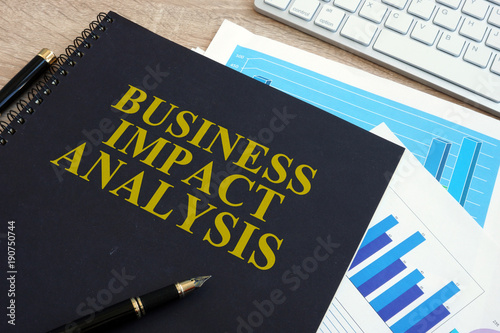 Business impact analysis (BIA) on a office desk. photo