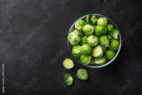 fresh raw brussel sprouts in glass bowl. © anna_shepulova