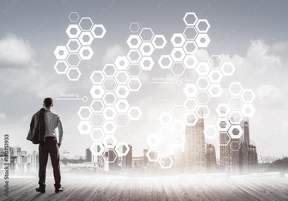 Pensive businessman looking at user interface against modern cit