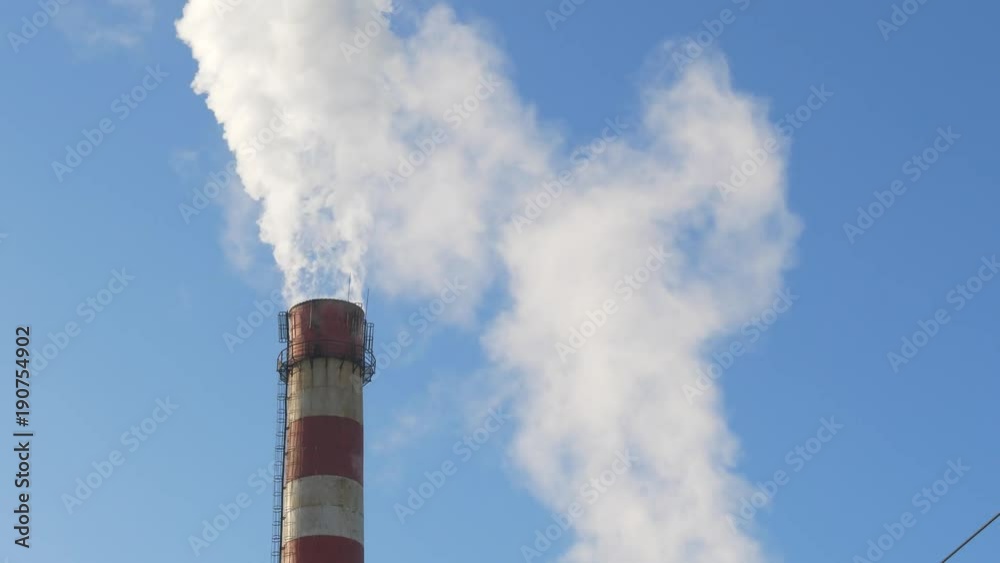Close up smoke stack over blue sky background. Energy generation and air environment pollution industrial scene. 4K UHD video footage. Close up smoke stack over blue sky background. Energy generation and air environment pollution industrial scene. 4K UHD video footage.