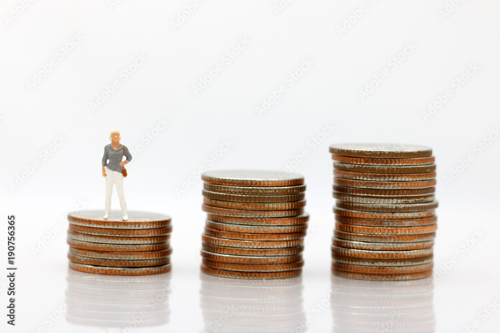Miniature people: Businesswoman standing on step of coin money.  Concept of Financial and money.