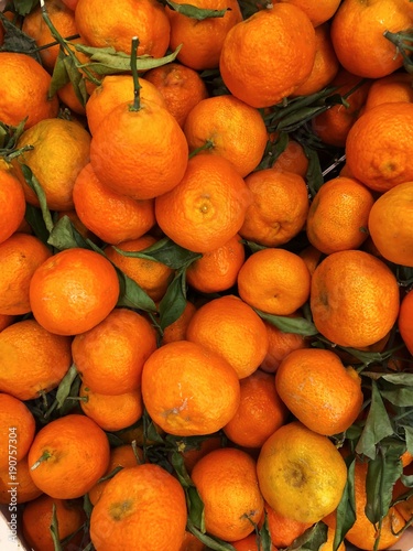 Fresh ripe tangerines in box on the market 