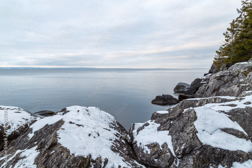 Cliffs at sea in winter with snow Cliffs at sea in winter with snow