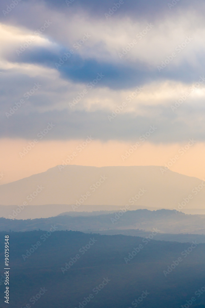 Landscape photo mountain layer and sunlight at sunset Phu kradueng national park , Thailand Landscape photo mountain layer and sunlight at sunset Phu kradueng national park , Thailand