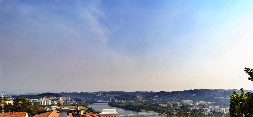 View of the Mondego River as it passes through Coimbra (Portugal) and part of the city from the University of Coimbra View of the Mondego River as it passes through Coimbra (Portugal) and part of the city from the University of Coimbra