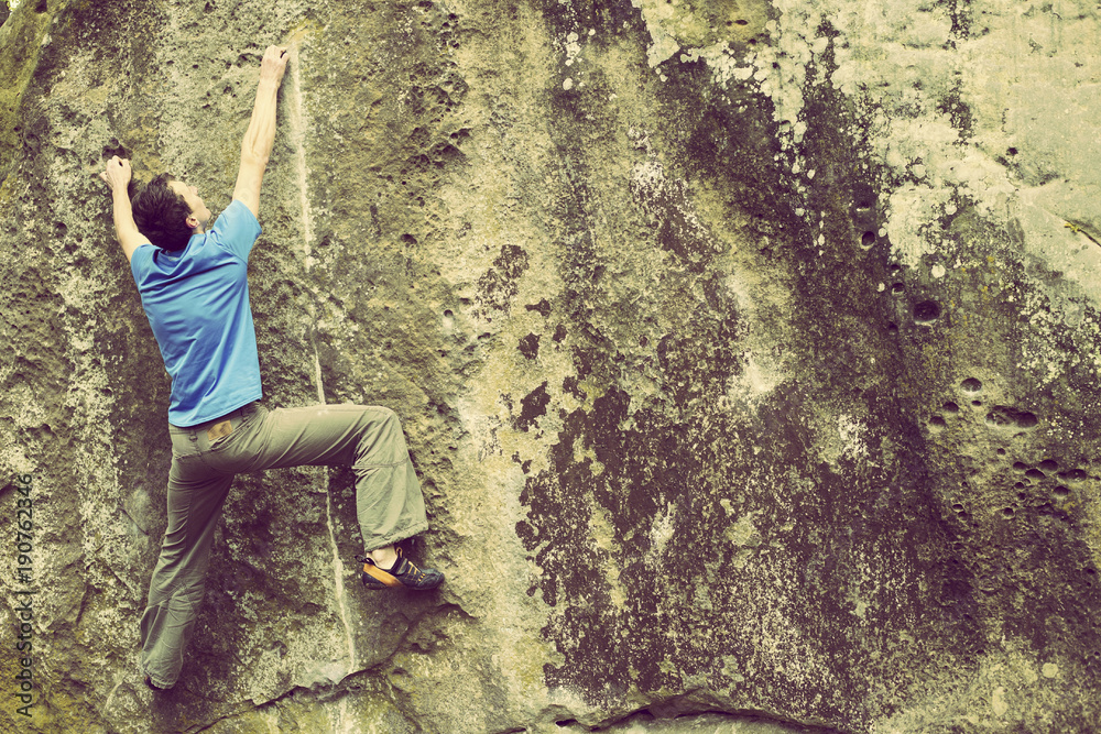 Obraz premium Climber to climb a big wall.