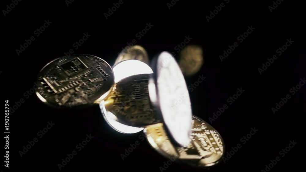 Crypto currency symbol of coin pours down on a black background. Slow motion Crypto currency symbol of coin pours down on a black background. Slow motion