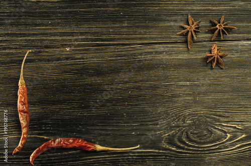 chili and anise on black boards