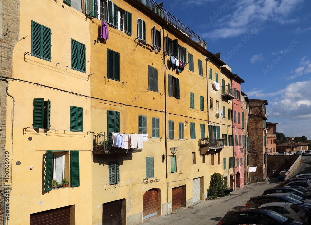 Laundry hangs from windows in Siena, Italy