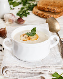 Gourmet cream soup with mushrooms (champignons), parsley and croutons. 