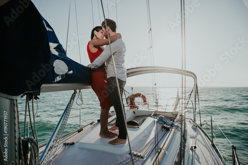 happy couple taking a romantic cruise on the sail boat © oneinchpunch