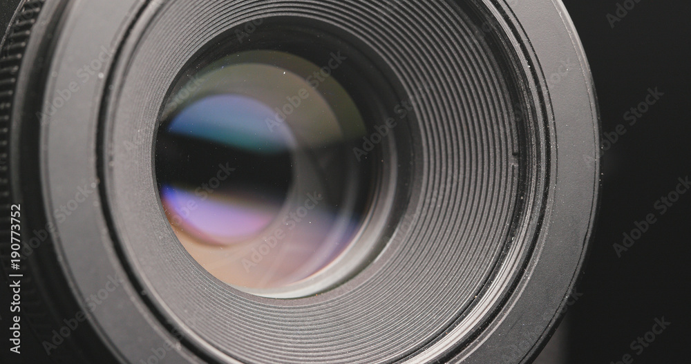 Camera lens adjusting aperture and zoom in and out Camera lens adjusting aperture and zoom in and out