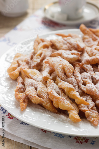 Angel wings biscuits, a traditional European sweet dish for carnival. Rustic style.