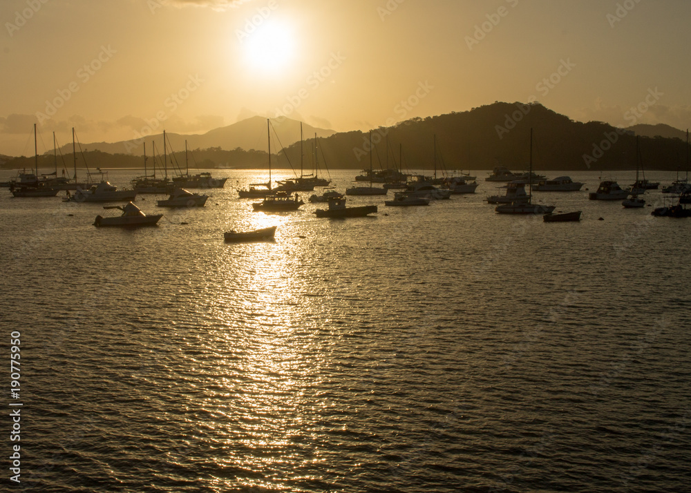 Sailboats and yachts at sunset in the Pacific Ocen