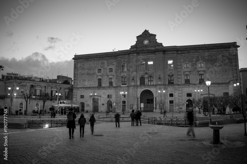 Horizontal View of the Annunziata Palace in Vittorio Veneto Square at Sunset. Matera, South of Italy photo