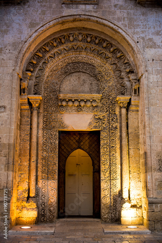 Vertical View of the Door of the Church of St. John Baptist at Night. Matera, South of Italy