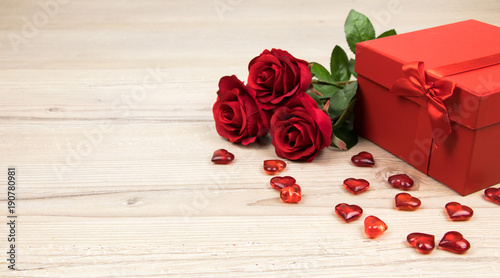 
valentines day, red roses with hearts and a gift box on wooden board, Valentines Day background, wedding day