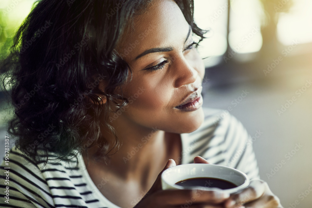 custom made wallpaper toronto digitalYoung African woman drinking a coffee looking deep in thought