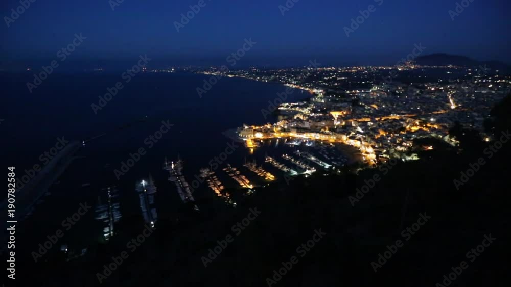 Night view to Tyrrenian sea bay, Castellammare del Golfo town and pier from resting place Localita Belvedere Castellammare del Golfo (Trapani region, Sicily, Italy). Alcamo town in far. Night view to Tyrrenian sea bay, Castellammare del Golfo town and pier from resting place Localita Belvedere Castellammare del Golfo (Trapani region, Sicily, Italy). Alcamo town in far.