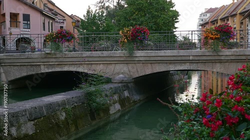 Bridge with beautiful flowers over Thiou river, Annecy old town, France.