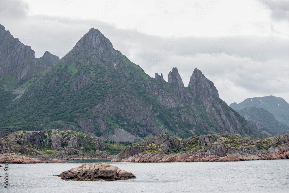 Impressive mountain landscape along the coast of northern Norway. Impressive mountain landscape along the coast of northern Norway.