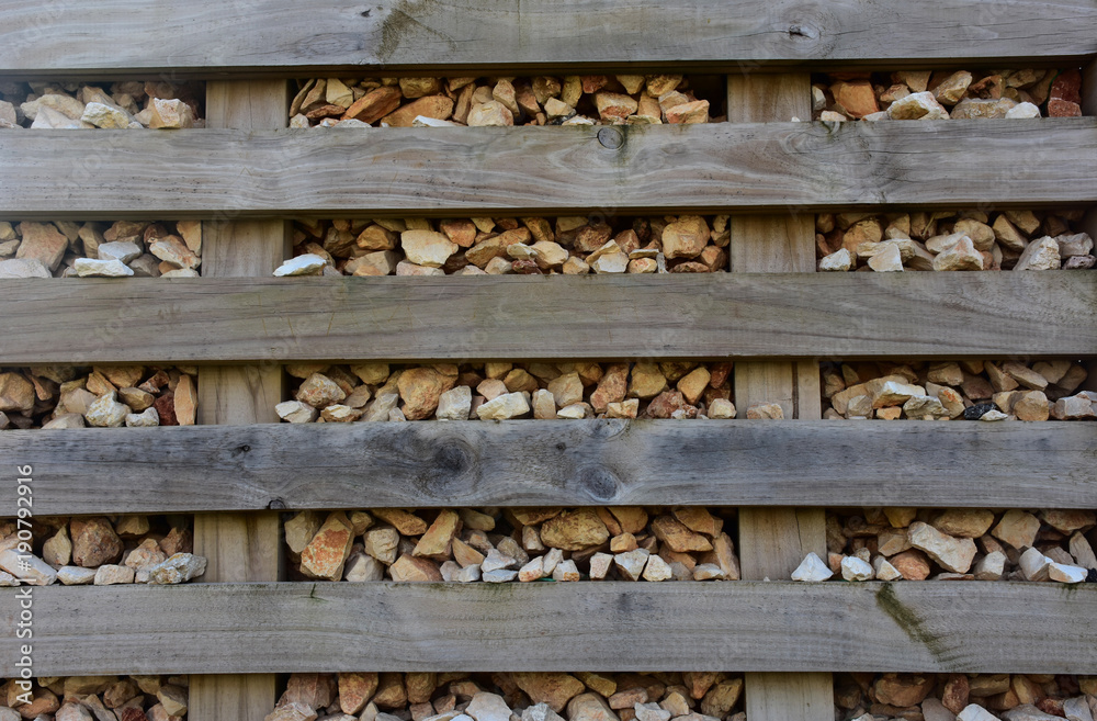 Stone walls and wood along the train tracks. Detail. Stone walls and wood along the train tracks. Detail.