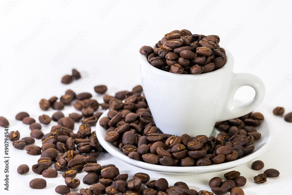 Coffee or espresso cup with coffee beans plain white background Coffee or espresso cup with coffee beans plain white background