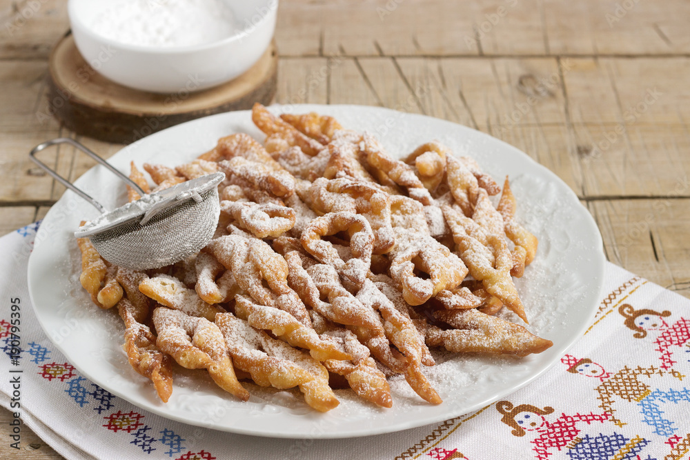 Angel wings biscuits, a traditional European sweet dish for carnival. Rustic style.