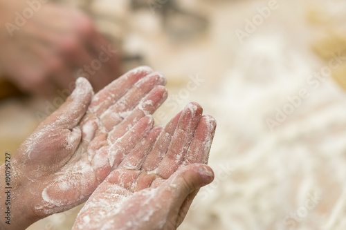 Baby hands in flour