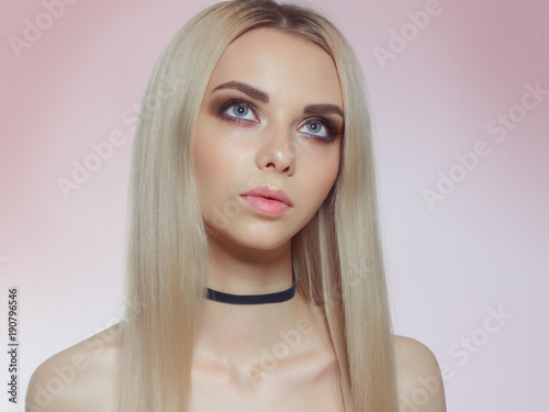 The blonde of beauty faces the Portrait. The beautiful Girl of the Spa model with Fine New Pure Leather. Youth and Concept of Care of skin. Isolated on a white background. Spa, cosmetology