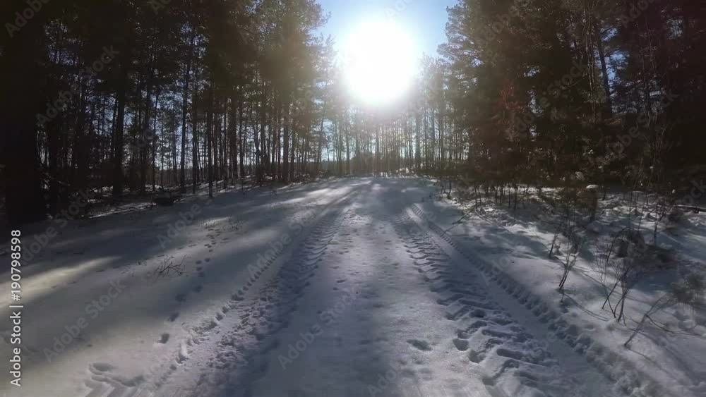 4K.Real movement of car in winter forest in sunny day, POV clip, FPV 4K.Real movement of car in winter forest in sunny day, POV clip, FPV