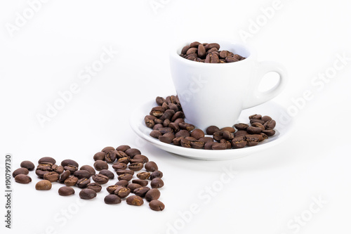 Coffee beans in a coffee or espresso cup next to a heart  Valentine s Day