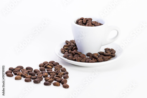 Coffee beans in a coffee or espresso cup next to a heart, Valentine's Day