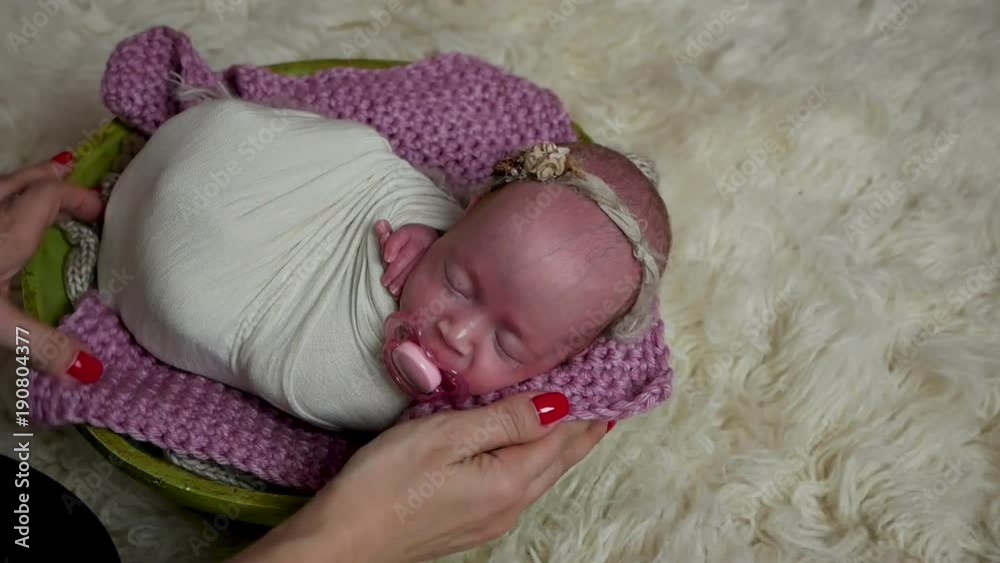 mom gives a pacifier to a newborn mom gives a pacifier to a newborn