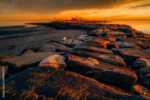Sunset on the Breakwater at Seaside Park in Bridgeport, Connecticut, USA.