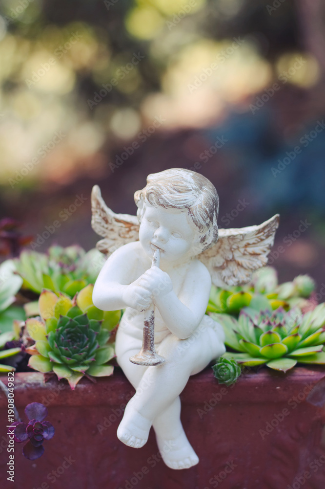 Porcelain angel as decoration in the garden Porcelain angel as decoration in the garden