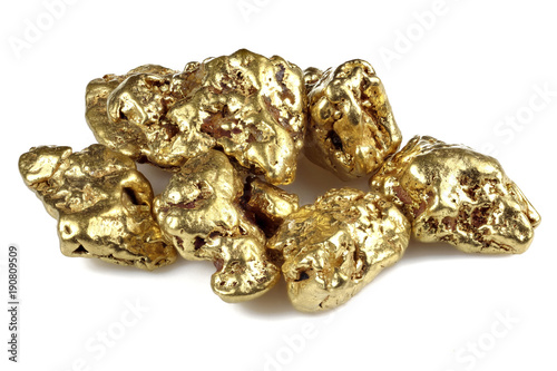 gold nuggets from Alaska isolated on white background