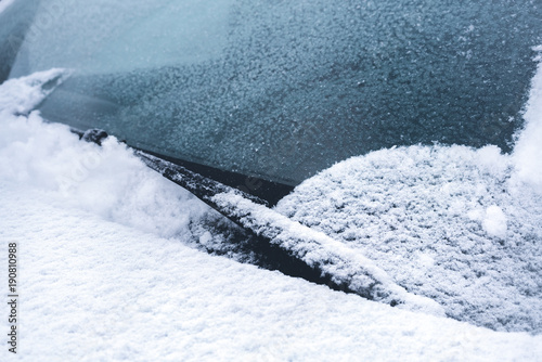 windscreen wiper. car under snow.