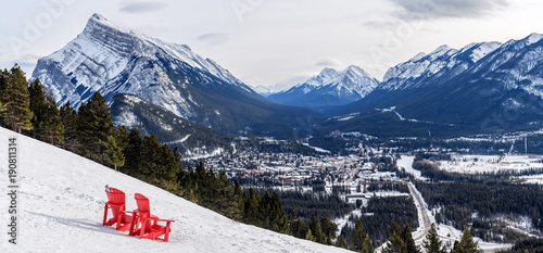 Aerial view of the city of Banff with that iconic red chairs in the foreground