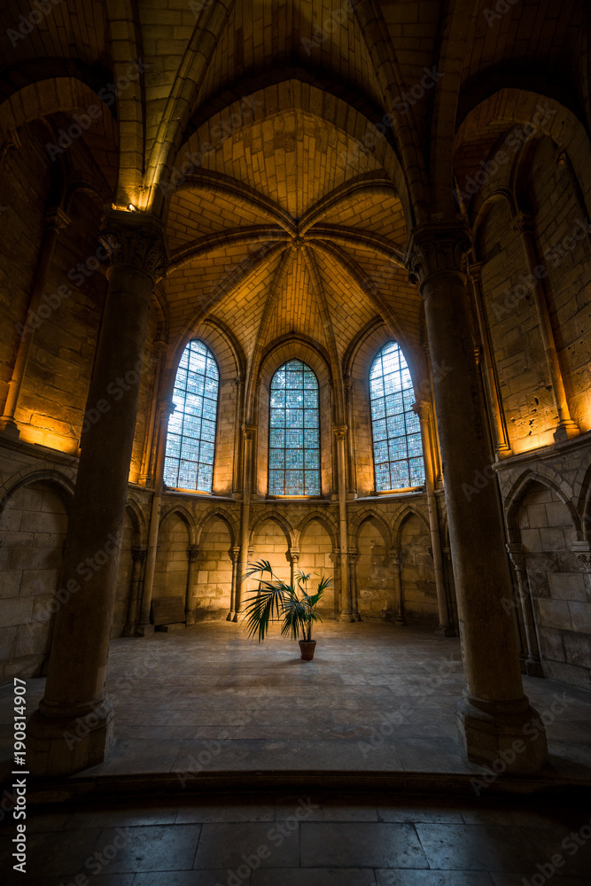 Warm light inside Saint-Remi abbey in Reims, France