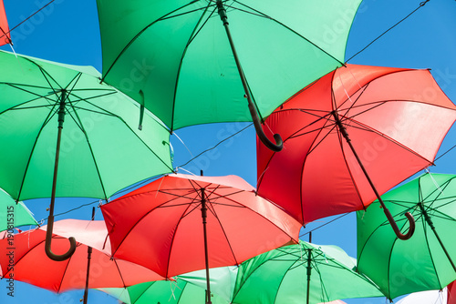 simple colored umbrellas suspended on the streets of Guatape