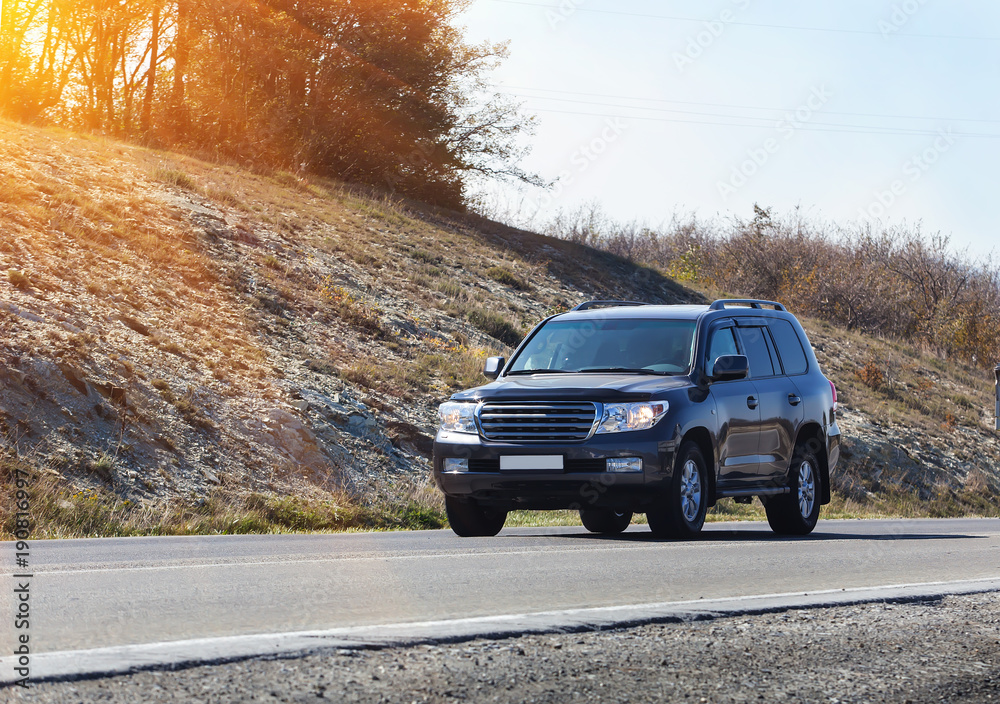Fototapeta premium crossover moving along country road