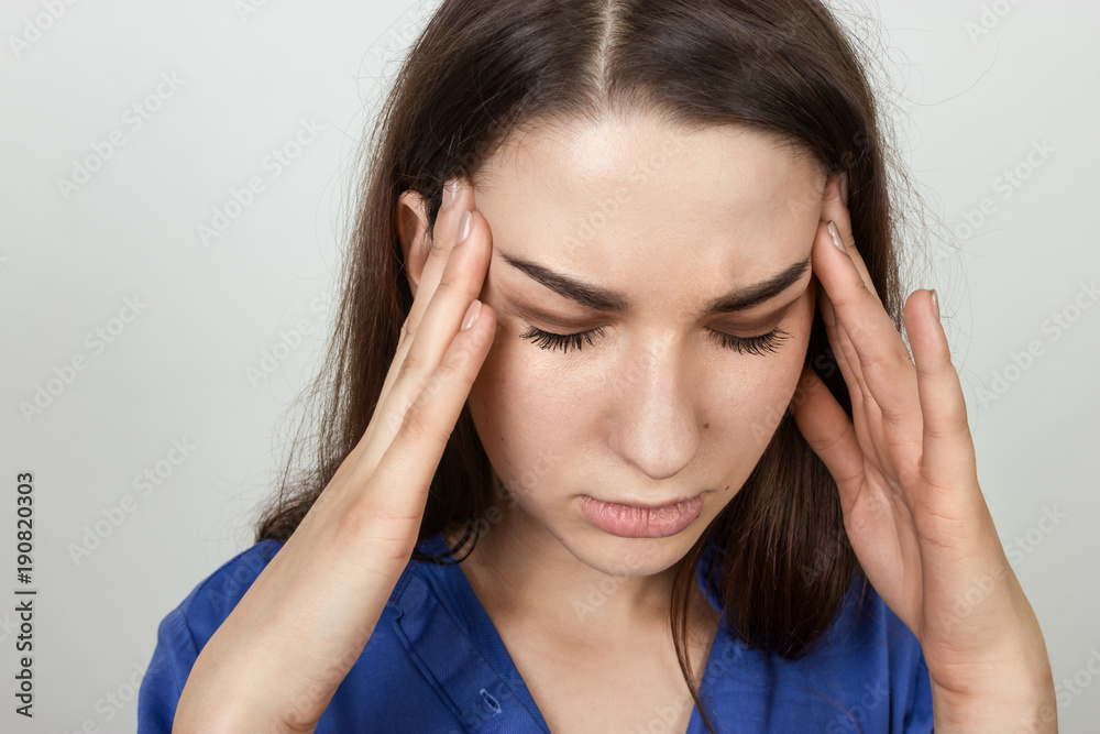 Portrait of a pretty woman stress and headache having migraine pain Portrait of a pretty woman stress and headache having migraine pain