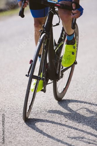 Fototapeta Naklejka Na Ścianę i Meble -  A professional cyclist on a mountain road