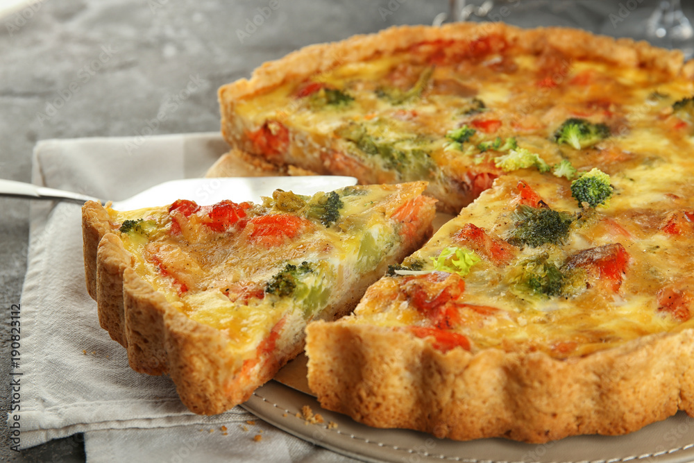 Tasty broccoli quiche on table, closeup Tasty broccoli quiche on table, closeup