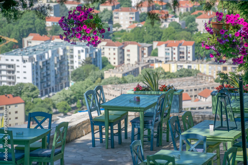 Cozy panoramic tables in a cafe on the terrace over an ancient city.