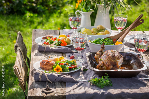 Fresh dinner with salad and chicken served in summer